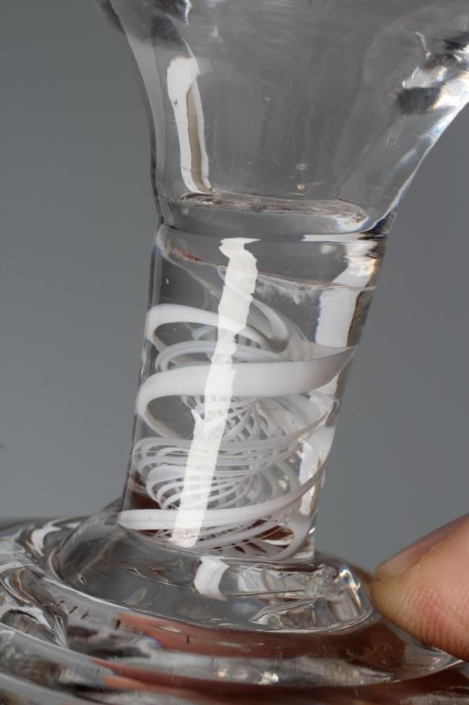 A FIRING GLASS, mid 18th century, the ogee bowl on a short double series opaque twist stem and Image