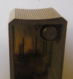 A DUNHILL 9CT GOLD ROLLAGAS CIGARETTE LIGHTER of plain oblong form with engine turning, 2 1/2" high, Image