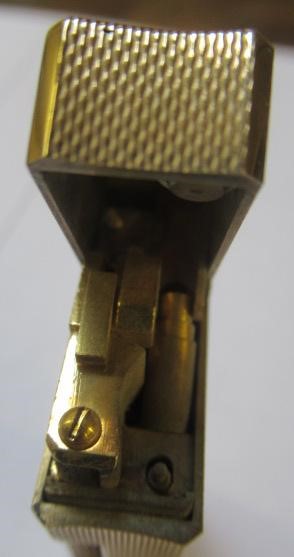 A DUNHILL 9CT GOLD ROLLAGAS CIGARETTE LIGHTER of plain oblong form with engine turning, 2 1/2" high, Image