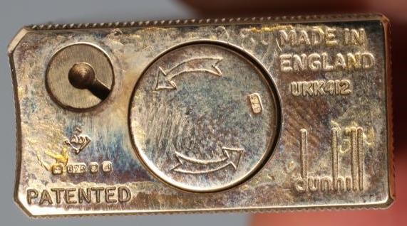 A DUNHILL 9CT GOLD ROLLAGAS CIGARETTE LIGHTER of plain oblong form with engine turning, 2 1/2" high, Image