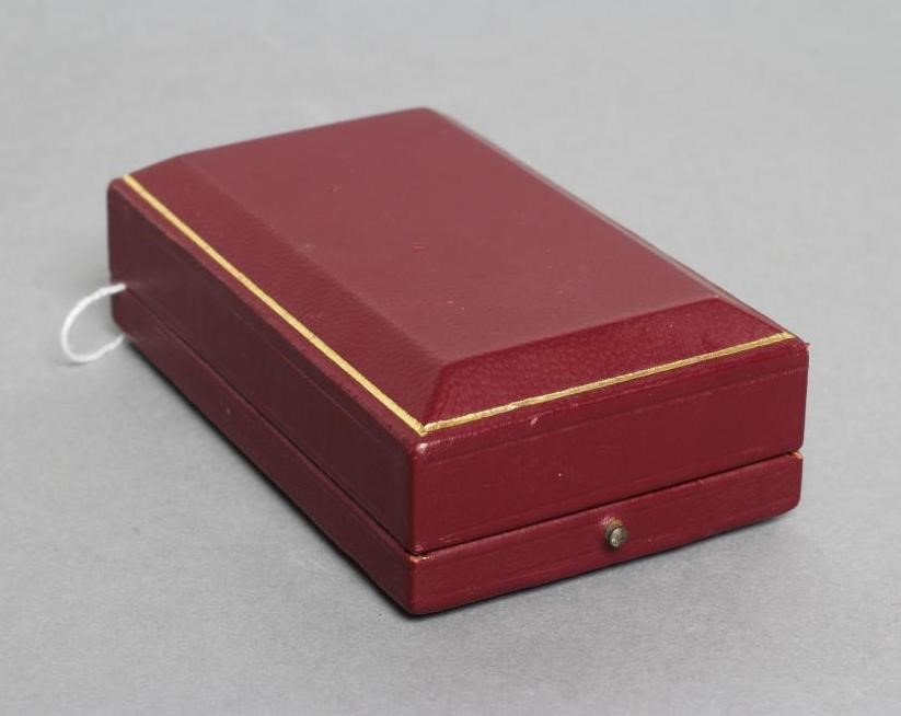 A DUNHILL 9CT GOLD ROLLAGAS CIGARETTE LIGHTER of plain oblong form with engine turning, 2 1/2" high, Image