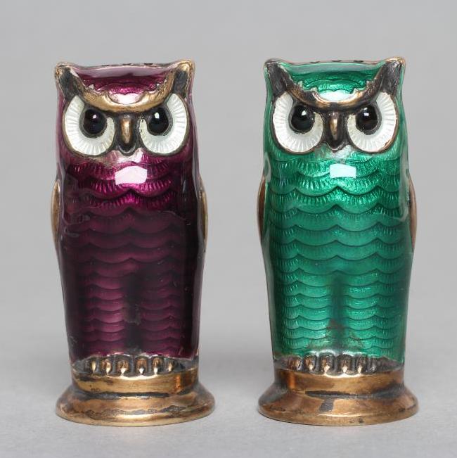 A PAIR OF NORWEGIAN SILVER GILT AND ENAMEL OWL PEPPERETTES Image