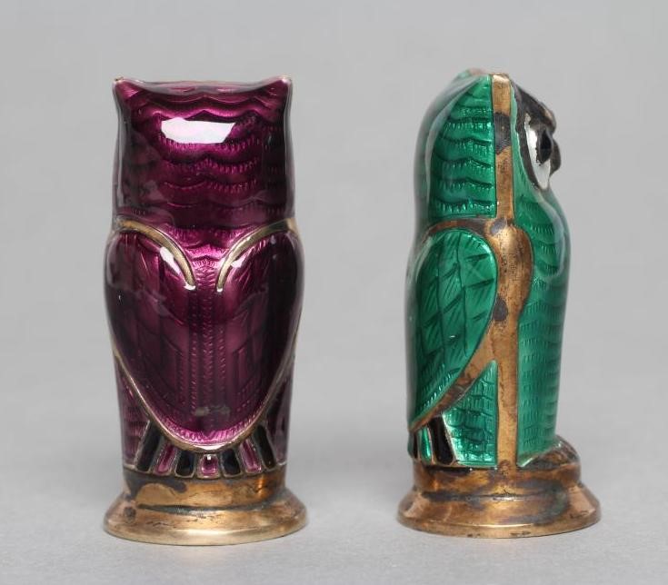 A PAIR OF NORWEGIAN SILVER GILT AND ENAMEL OWL PEPPERETTES Image