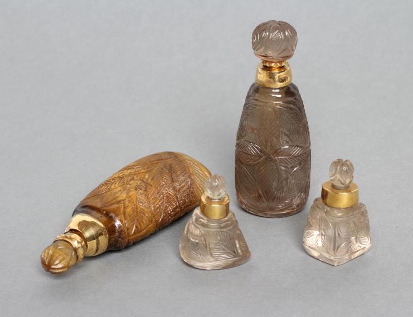 A BANDED AGATE PERFUME BOTTLE AND STOPPER carved and polished in low relief with palm fronds Image