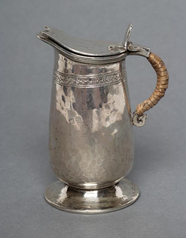 A MINIATURE SILVER JUG Image