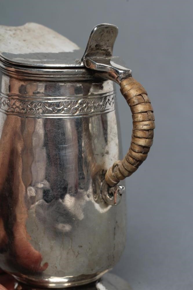 A MINIATURE SILVER JUG Image