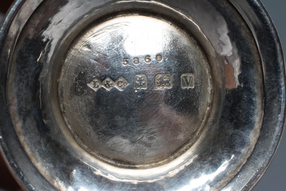 A MINIATURE SILVER JUG Image