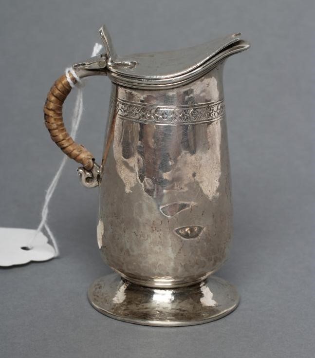 A MINIATURE SILVER JUG Image