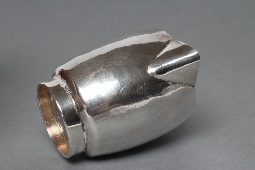 A SMALL SILVER JUG, maker Nancy Goodman, London 1975, of planished slightly bombe cylindrical form Image