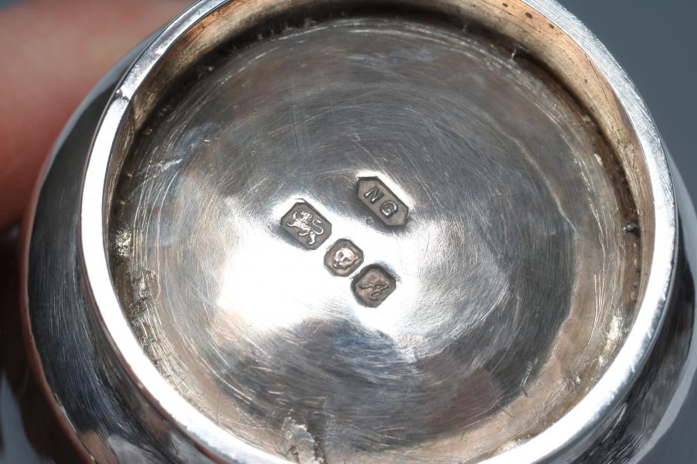 A SMALL SILVER JUG, maker Nancy Goodman, London 1975, of planished slightly bombe cylindrical form Image