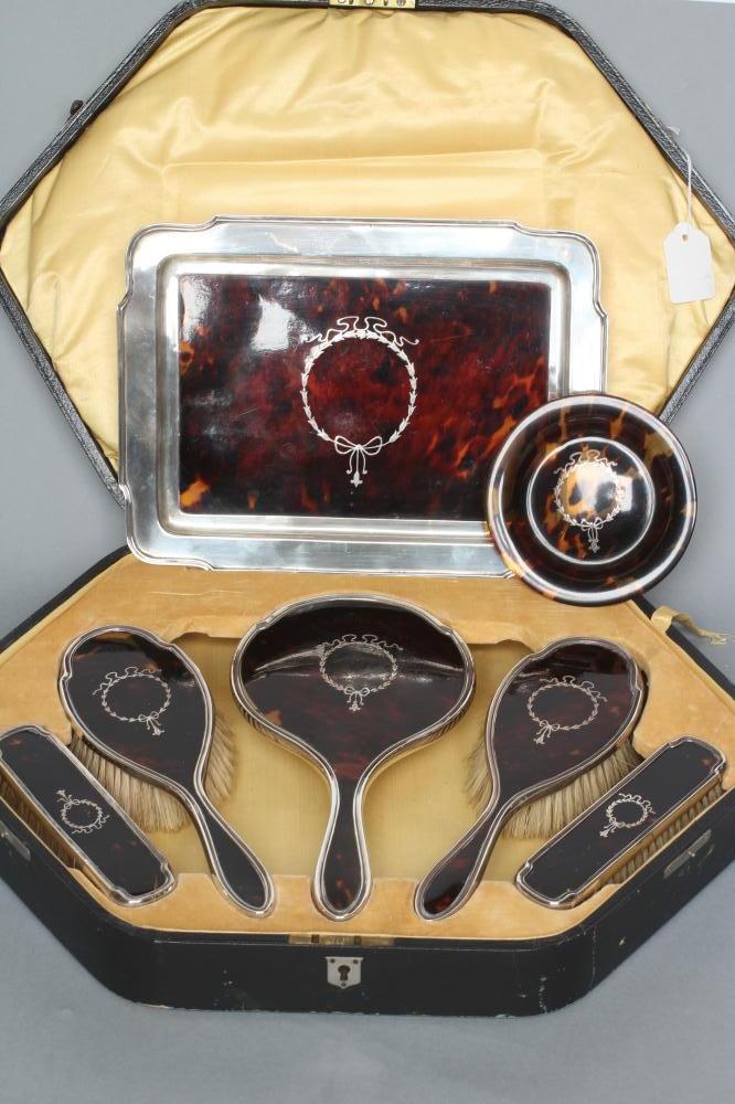 A SILVER AND TORTOISESHELL PIQUE WORK DRESSING TABLE SET Image