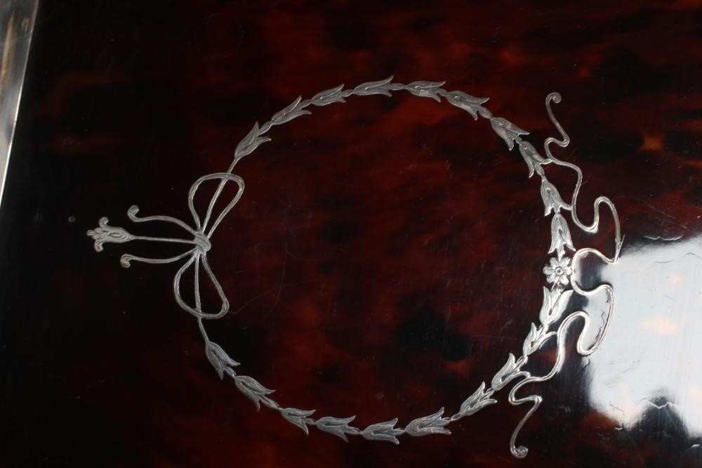 A SILVER AND TORTOISESHELL PIQUE WORK DRESSING TABLE SET Image