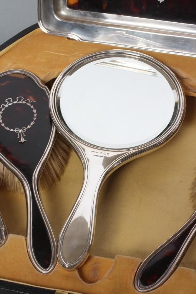 A SILVER AND TORTOISESHELL PIQUE WORK DRESSING TABLE SET Image