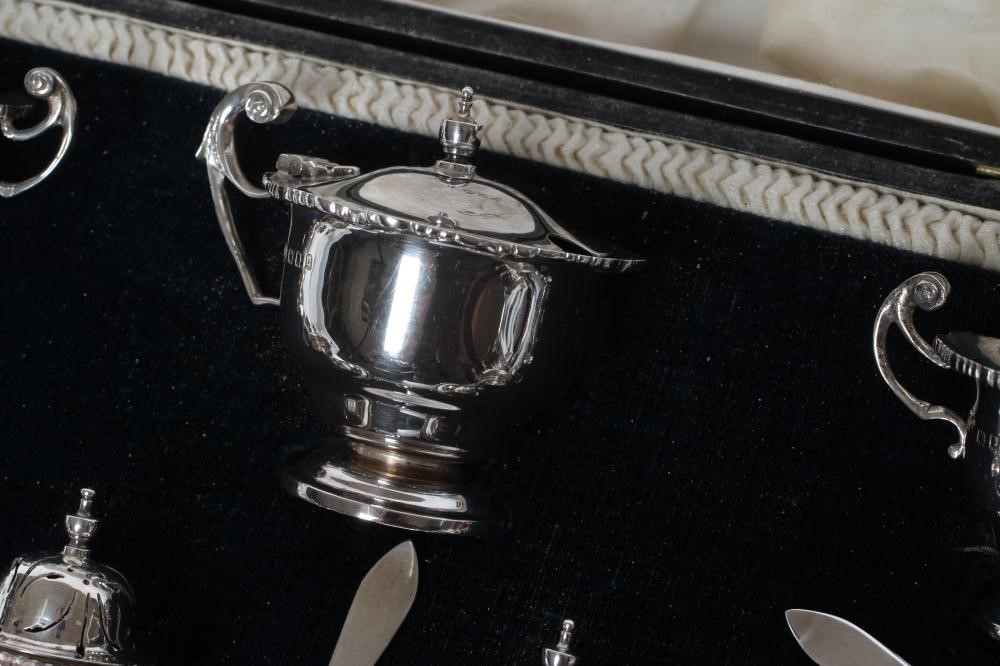 A SEVEN PIECE SILVER CRUET Image