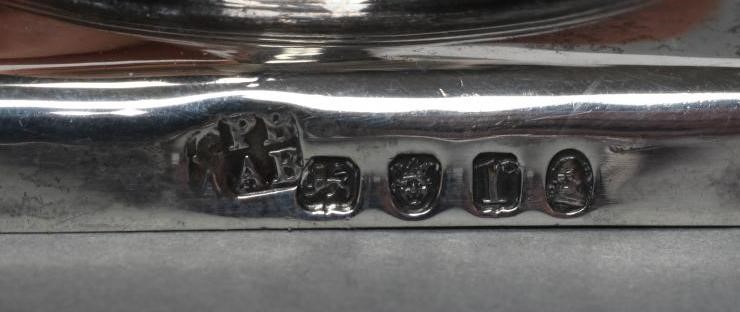 A LATE GEORGE III SILVER HELMET JUG Image