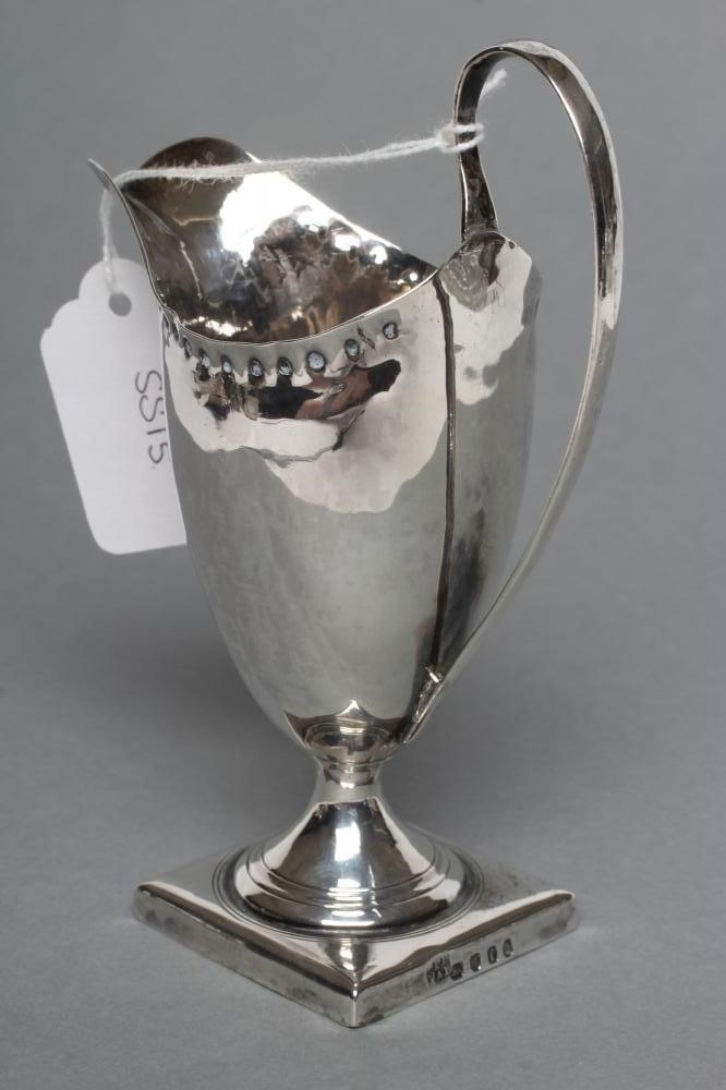 A LATE GEORGE III SILVER HELMET JUG Image