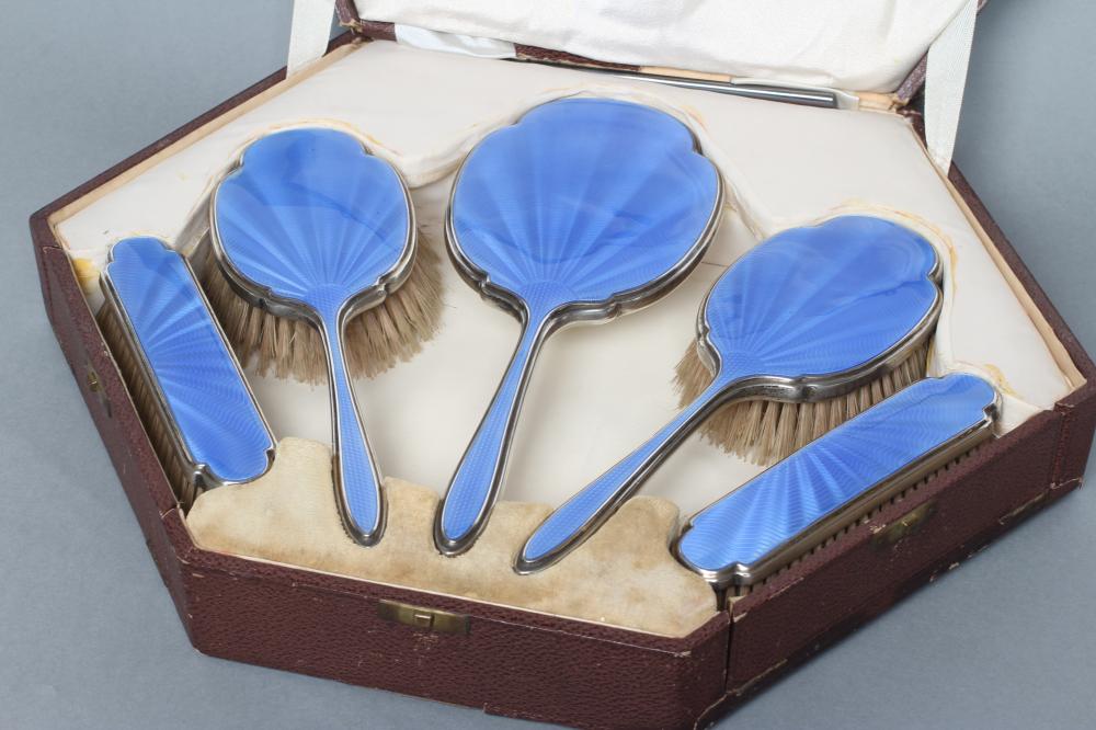 AN ART DECO SILVER SIX PIECE DRESSING TABLE SET Image