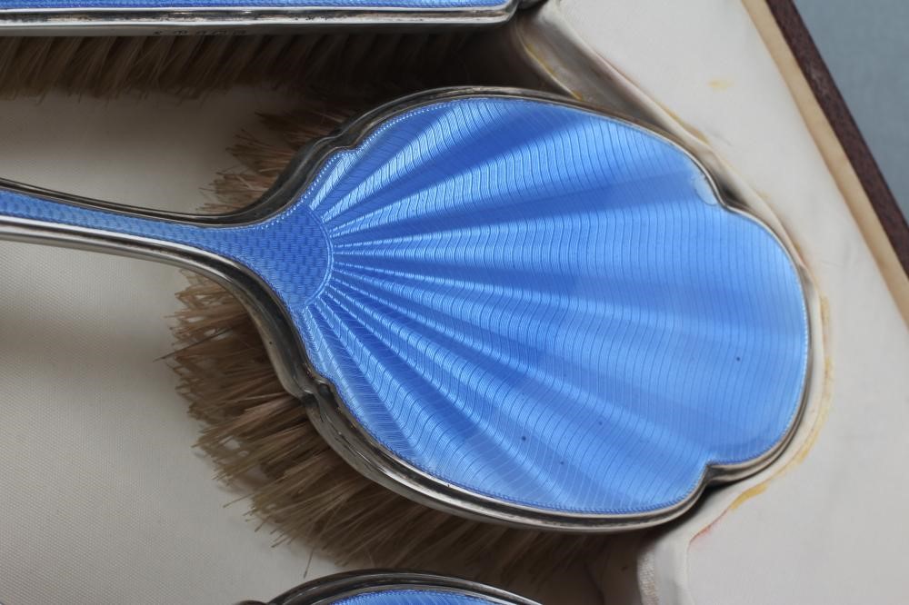 AN ART DECO SILVER SIX PIECE DRESSING TABLE SET Image