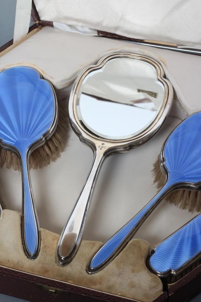 AN ART DECO SILVER SIX PIECE DRESSING TABLE SET Image