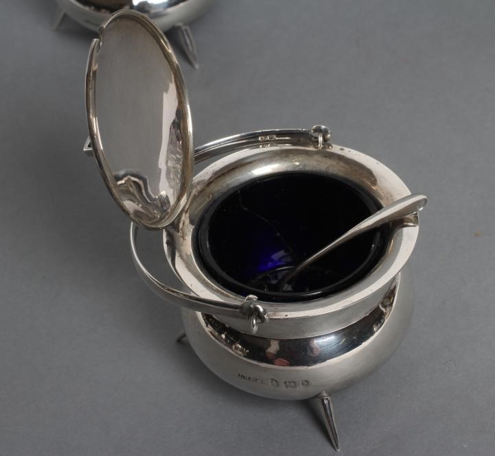 A LATE VICTORIAN NOVELTY THREE PIECE SILVER CAULDRON CRUET Image