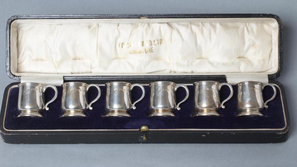 A SET OF SIX MINIATURE SILVER MUGS Image