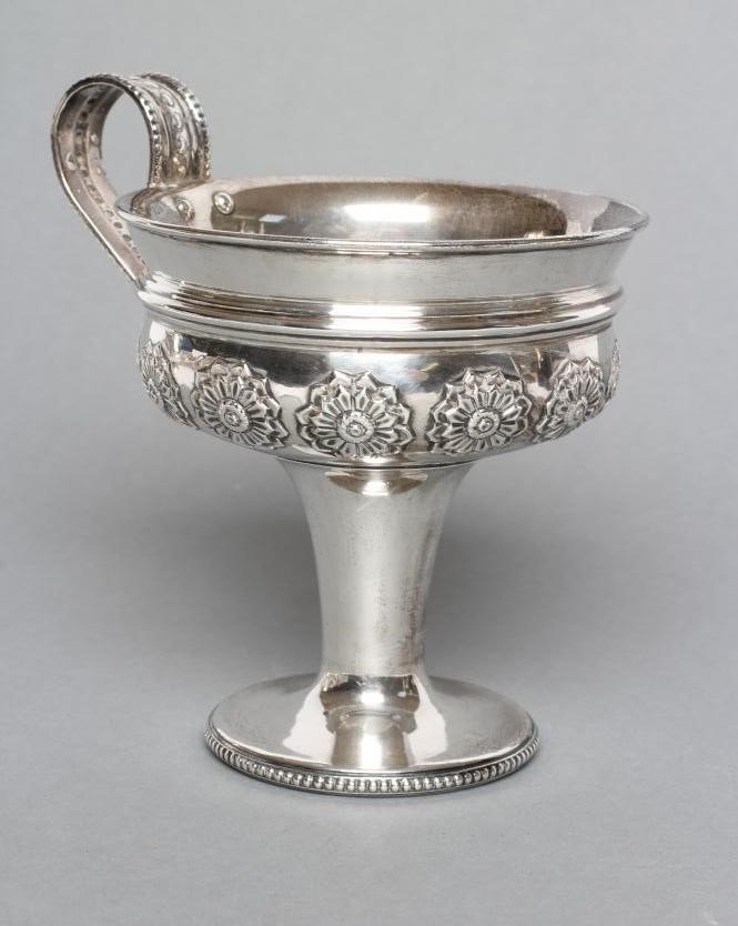 AN EDWARDIAN SILVER ARTS AND CRAFTS PEDESTAL CUP Image
