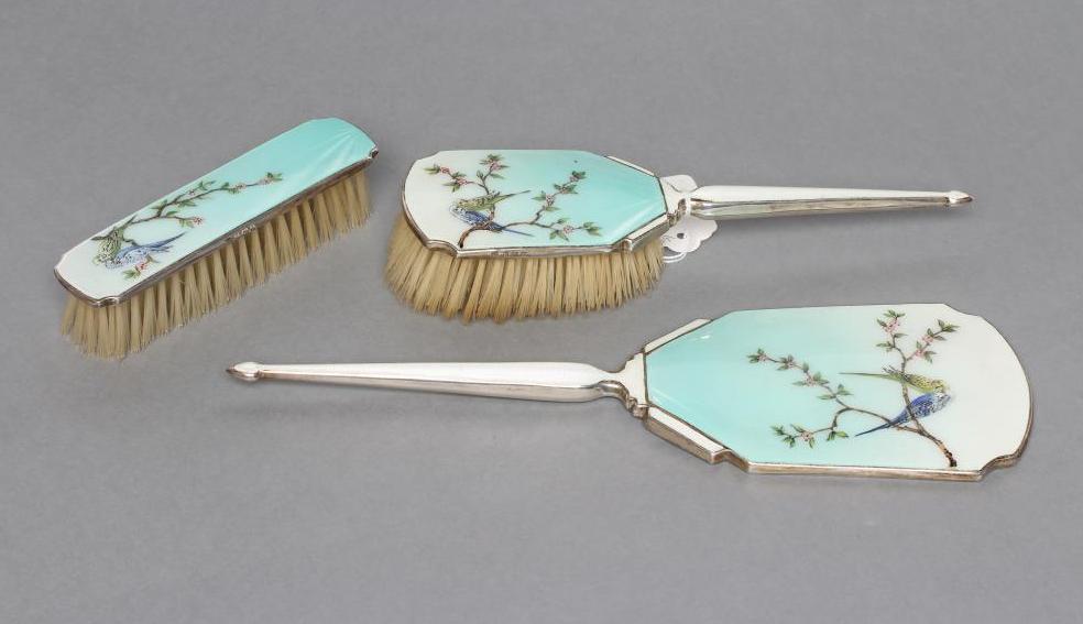 A THREE PIECE SILVER AND ENAMEL DRESSING TABLE SET Image