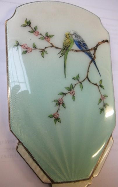 A THREE PIECE SILVER AND ENAMEL DRESSING TABLE SET Image