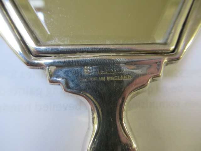 A THREE PIECE SILVER AND ENAMEL DRESSING TABLE SET Image