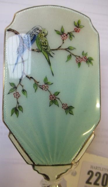 A THREE PIECE SILVER AND ENAMEL DRESSING TABLE SET Image