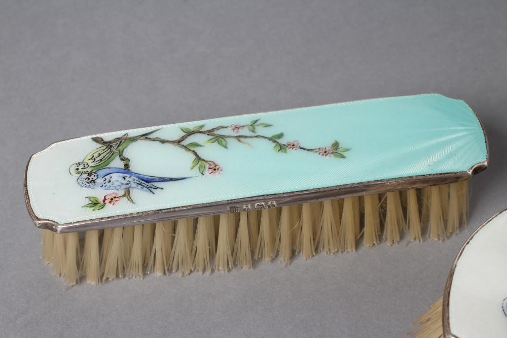 A THREE PIECE SILVER AND ENAMEL DRESSING TABLE SET Image