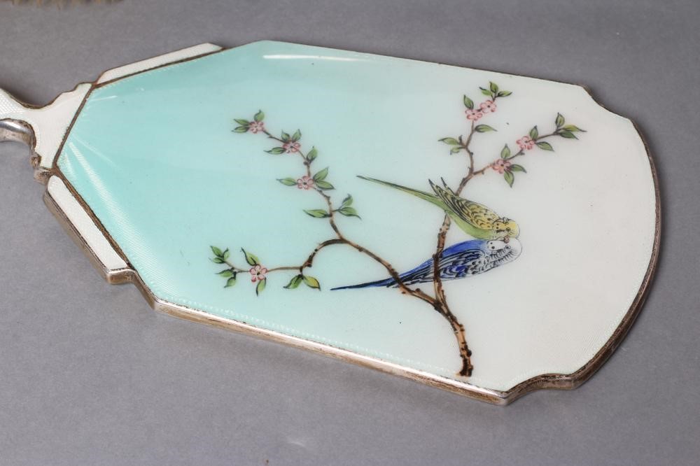 A THREE PIECE SILVER AND ENAMEL DRESSING TABLE SET Image