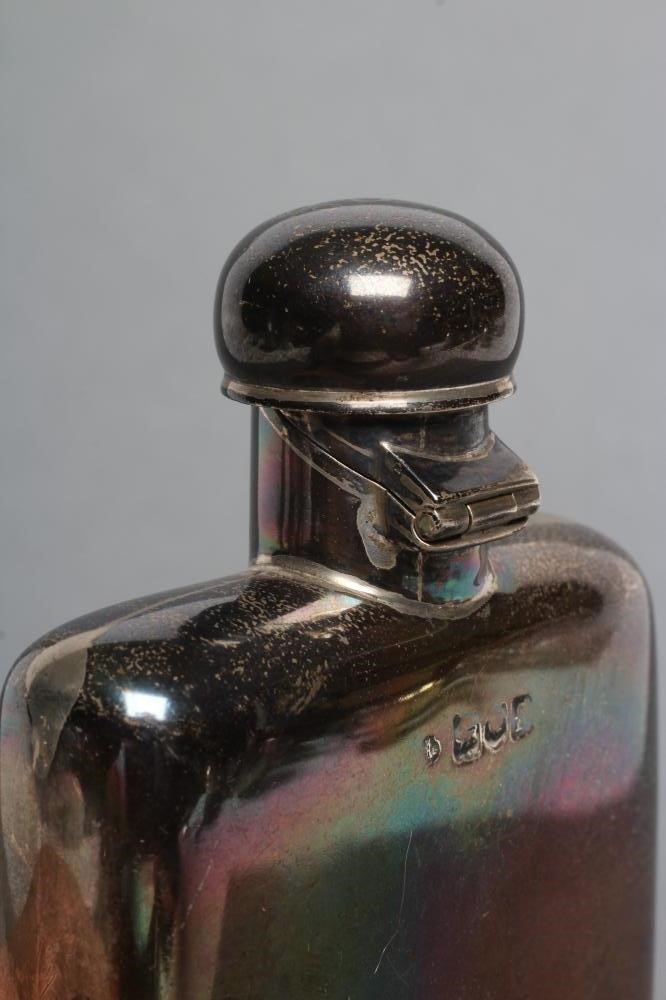 A LATE VICTORIAN SILVER HIP FLASK Image