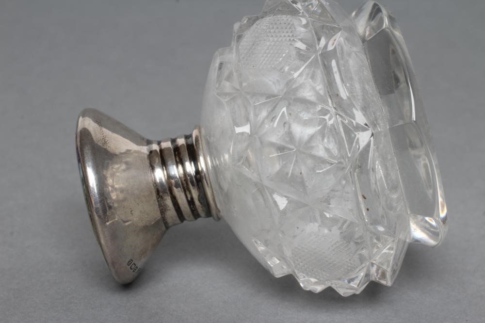 AN ART DECO GLASS SCENT BOTTLE of spherical form with slice and strawberry cut panels Image