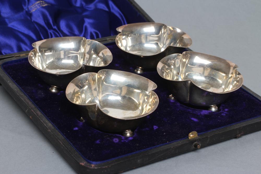 A SET OF FOUR EDWARDIAN SILVER BONBON DISHES Image
