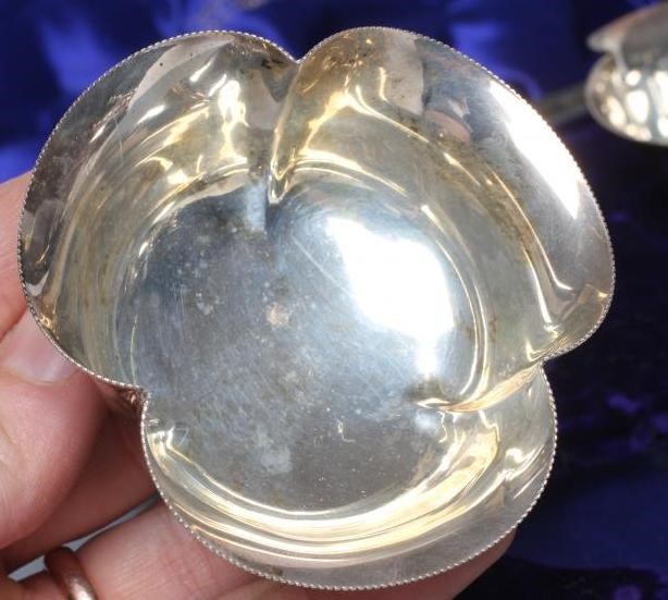 A SET OF FOUR EDWARDIAN SILVER BONBON DISHES Image