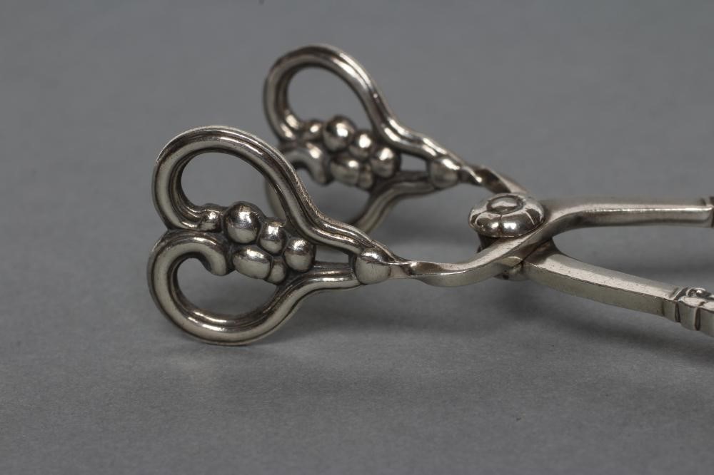 A PAIR OF GEORG JENSEN SILVER SPRING ACTION SUGAR NIPS Image