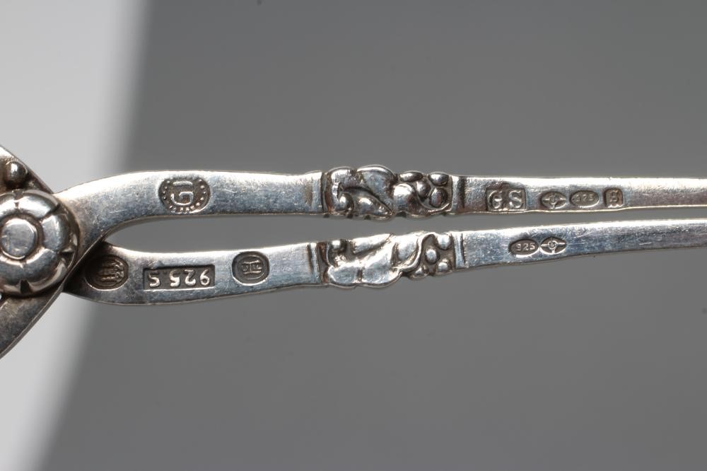 A PAIR OF GEORG JENSEN SILVER SPRING ACTION SUGAR NIPS Image
