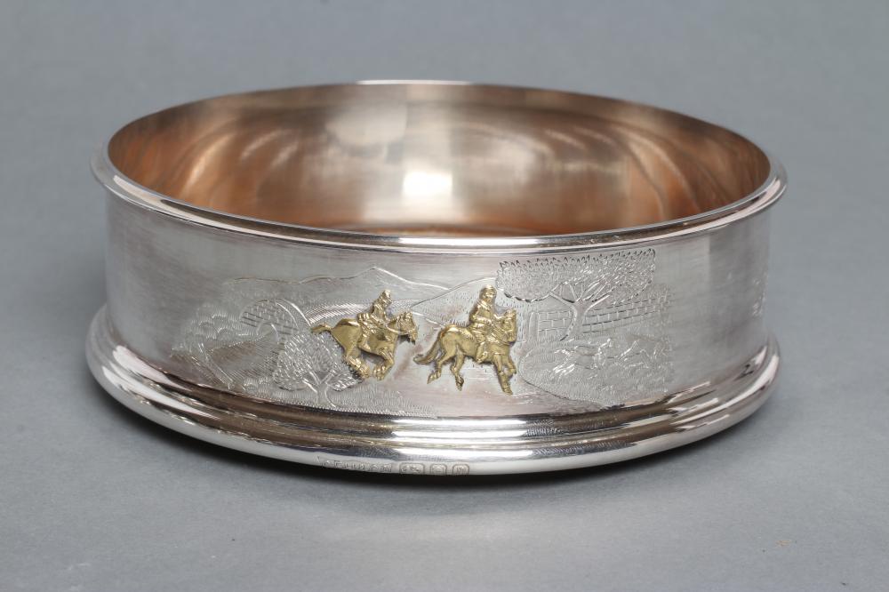 A SILVER BOTTLE COASTER Image