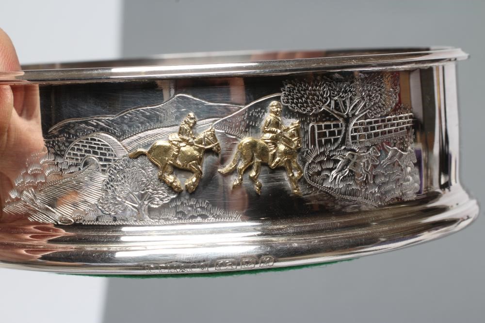 A SILVER BOTTLE COASTER Image