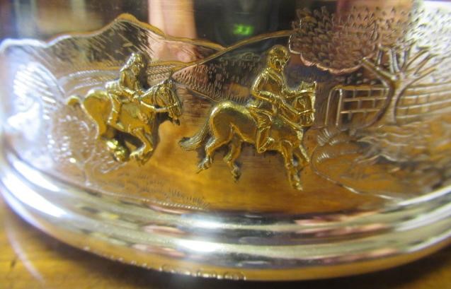 A SILVER BOTTLE COASTER Image