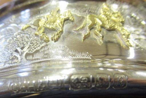 A SILVER BOTTLE COASTER Image