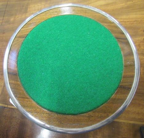 A SILVER BOTTLE COASTER Image