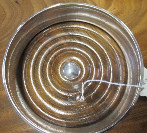 A SILVER BOTTLE COASTER Image