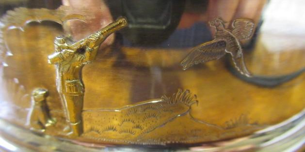 A SILVER BOTTLE COASTER Image