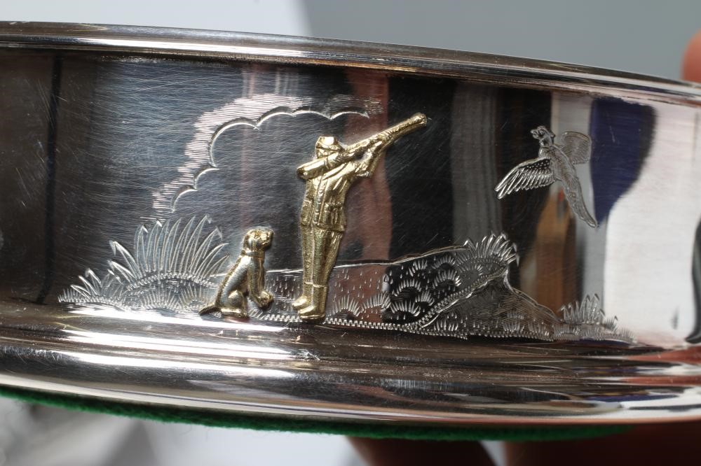 A SILVER BOTTLE COASTER Image