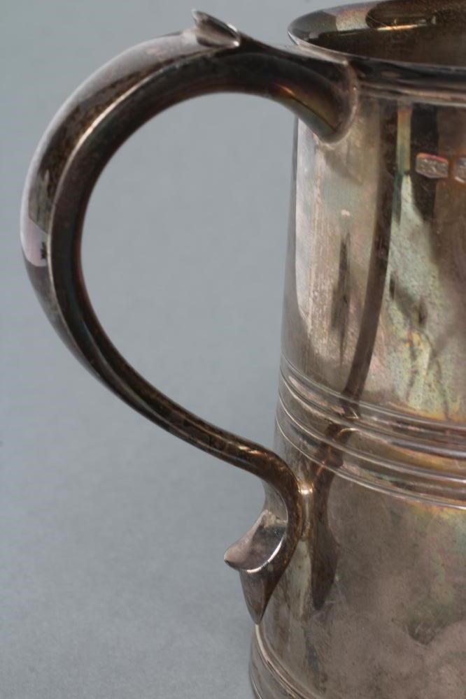 A SILVER PINT MUG, maker Roberts & Belk, Sheffield 1961, of girdled tapering cylindrical form with C Image