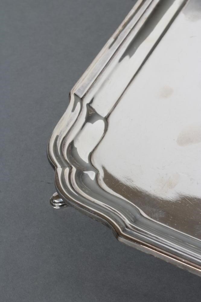 A SILVER SALVER, maker Barker Bros., Chester 1924, of square form with re-entrant corners, raised Image