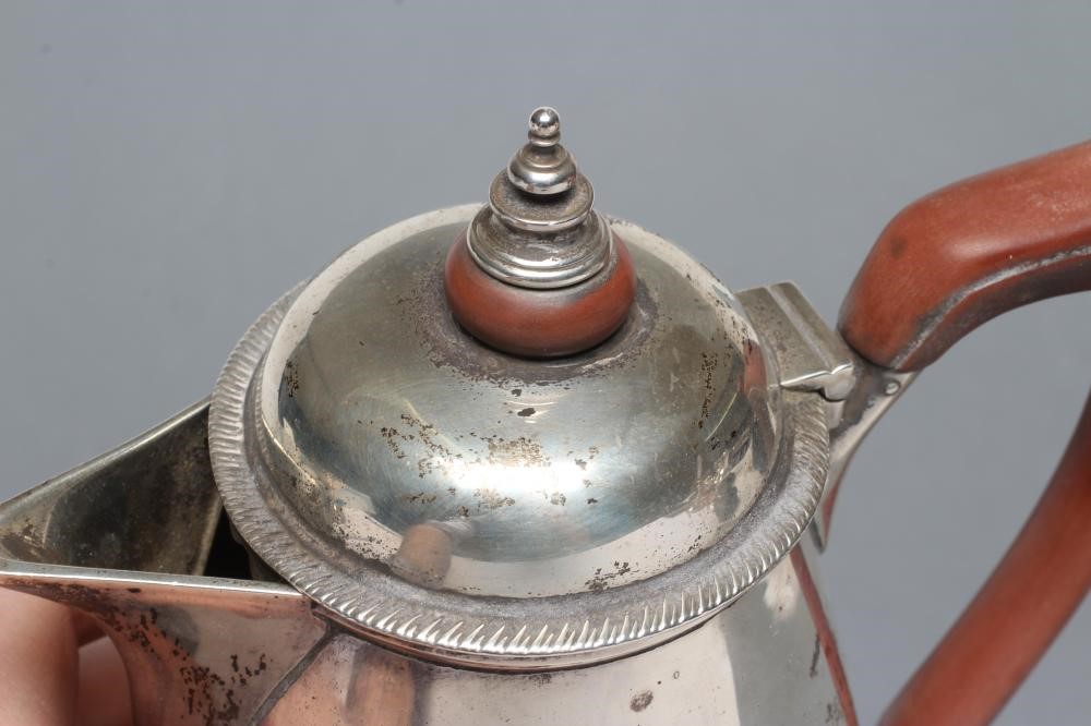 A SILVER HOT WATER JUG Image