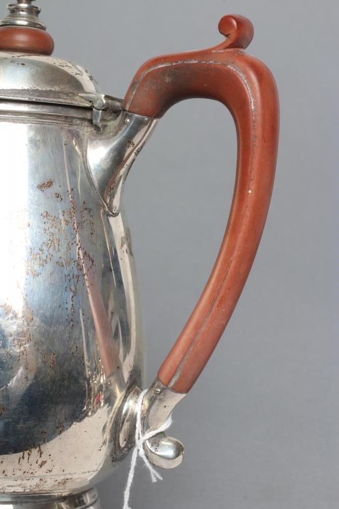 A SILVER HOT WATER JUG Image